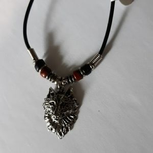 Wolf face silver necklace on black cord necklace